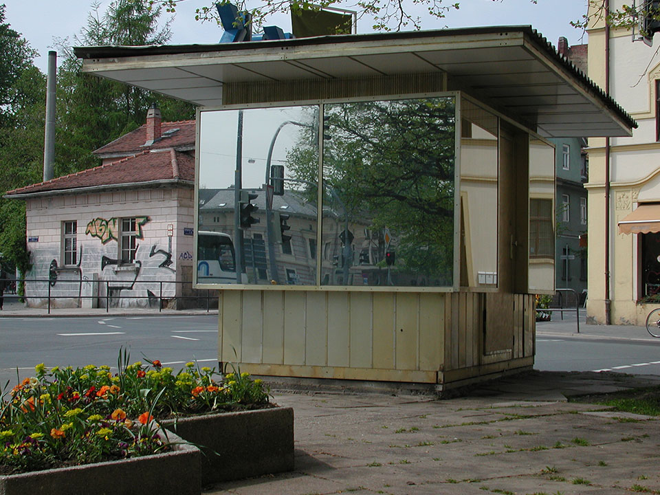 all windows of the K & K Kiosk covered with a mirror film