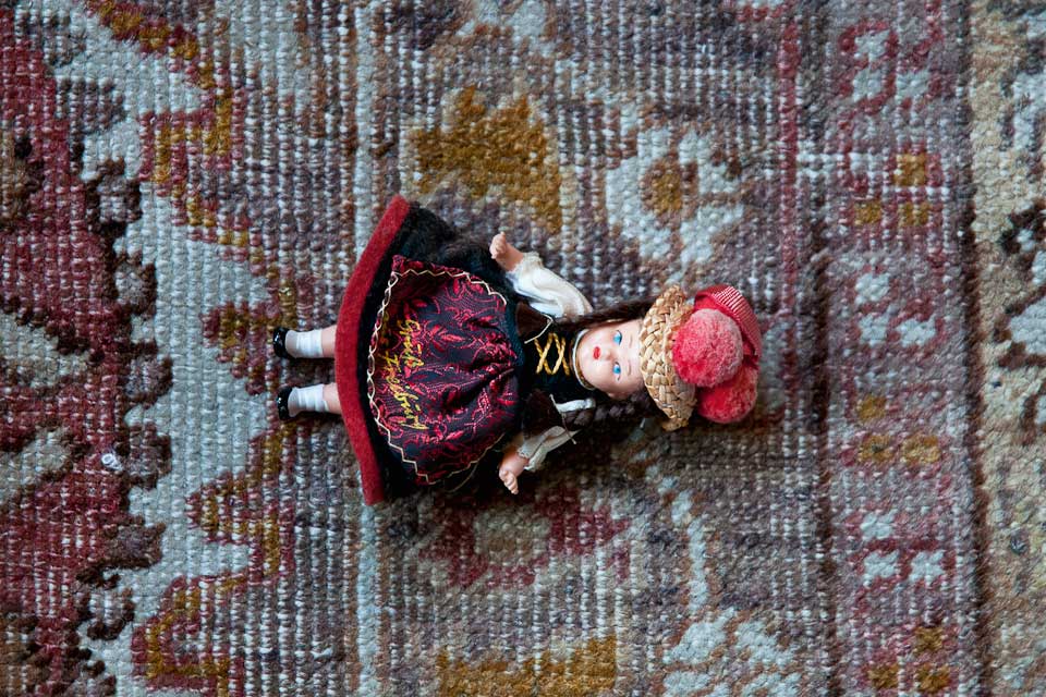 small black forest figurine on carpet