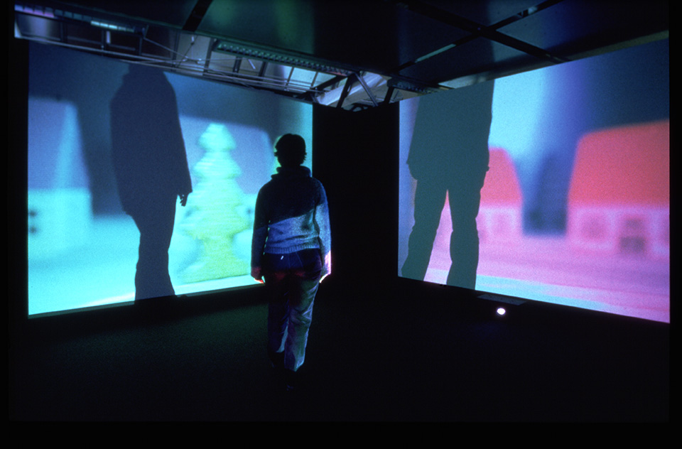 a person crossing a video projection