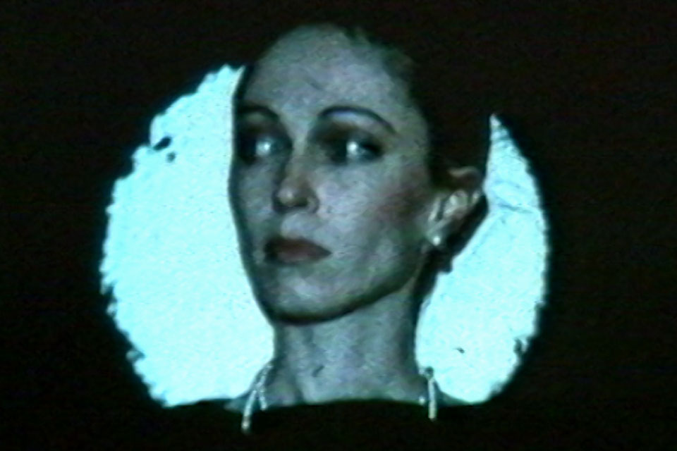 a woman's face, close up video still