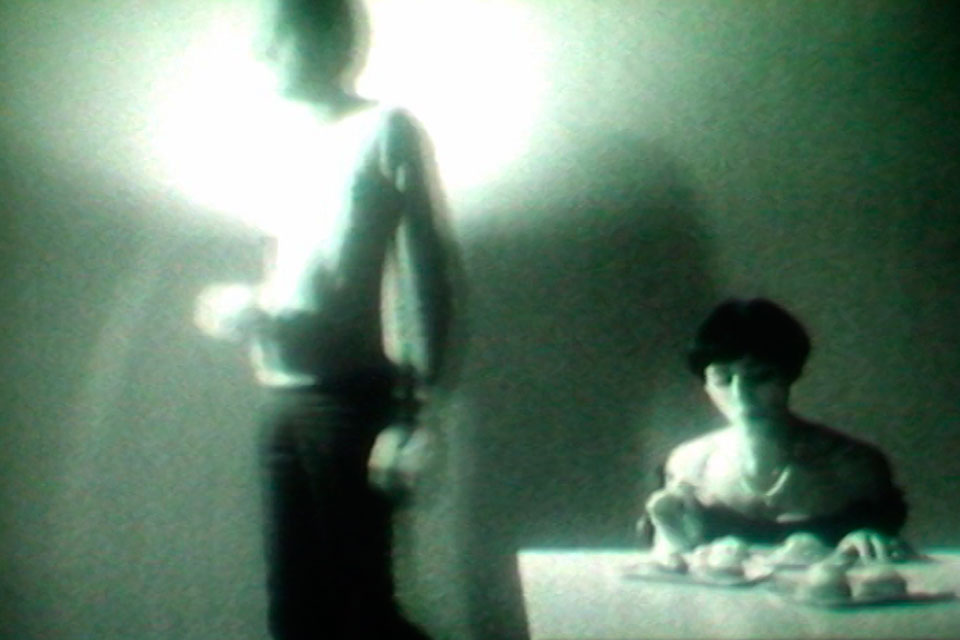 a man and a woman in one room, video still