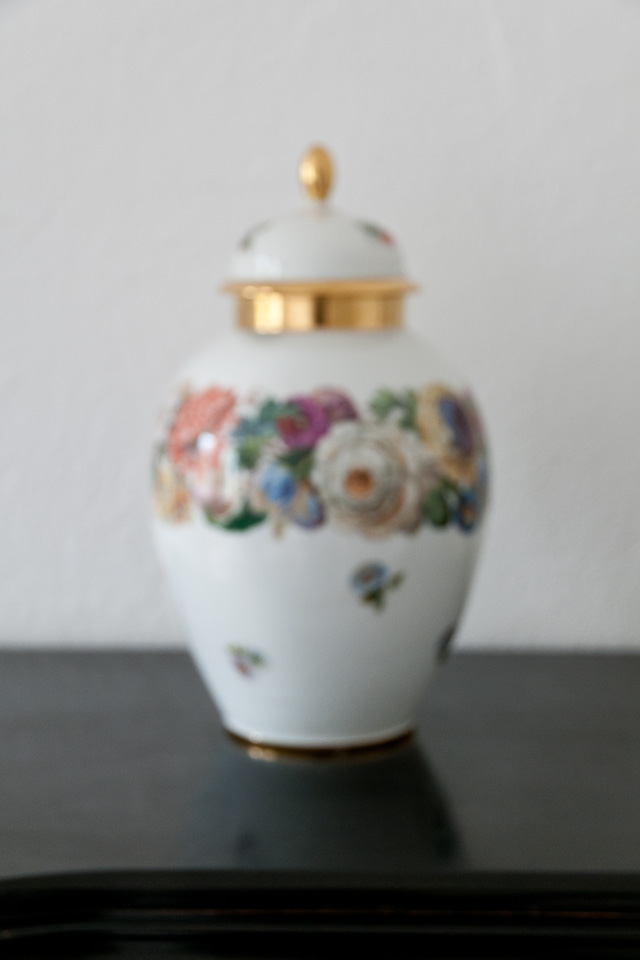 blurred porcelain vase with lid, photo