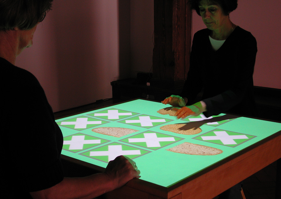 View of the installation table showing green playing cards