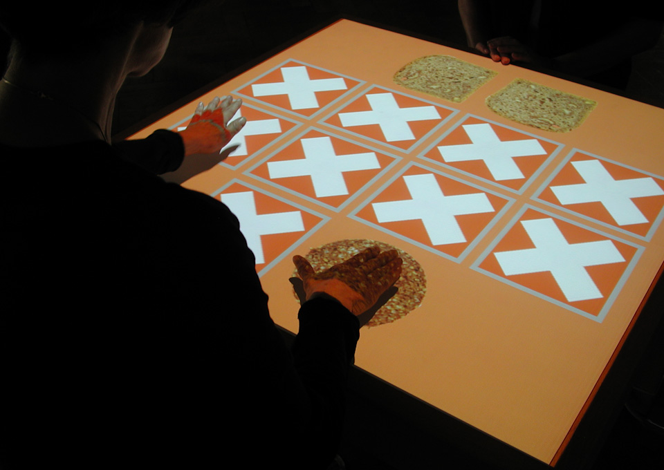View of the installation table showing orange playing cards