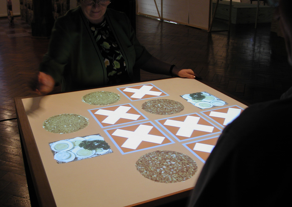Table with projected playing cards